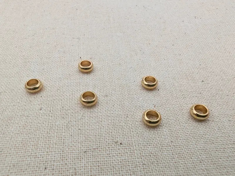 Perles intercalaires rondelles 5 mm acier inoxydable 304 doré - Lot de 10 ou 20 Les Précieuses Perles