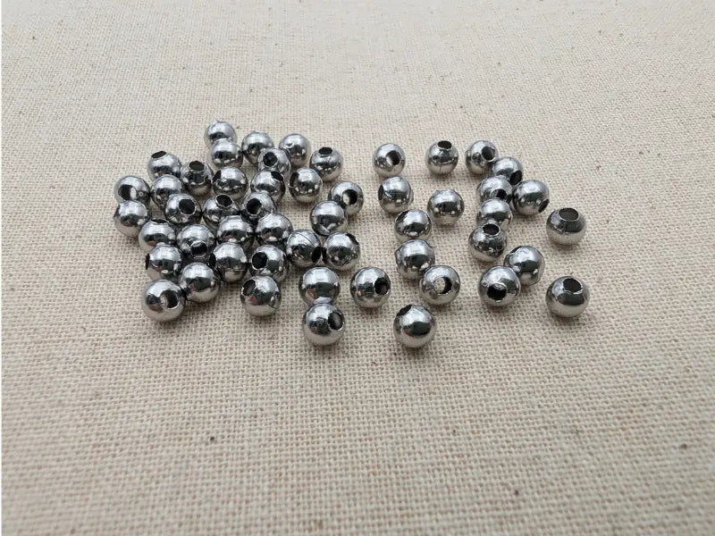 Perles rondes creuses 4 mm en acier inoxydable 304 – Lot de 50 ou 100 Les Précieuses Perles
