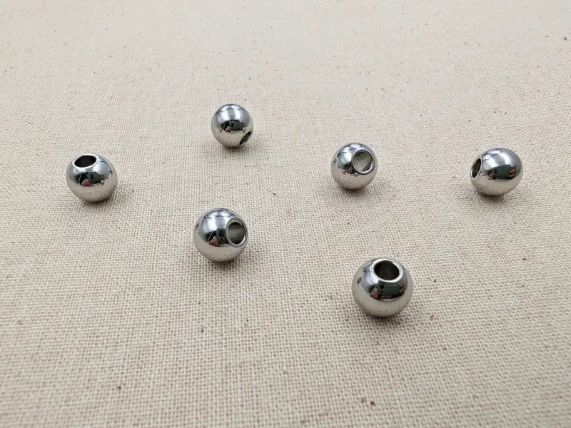 Perles rondes 8 mm acier inoxydable 202 - Trou 3 mm - Lot de 20 ou 40 Les Précieuses Perles