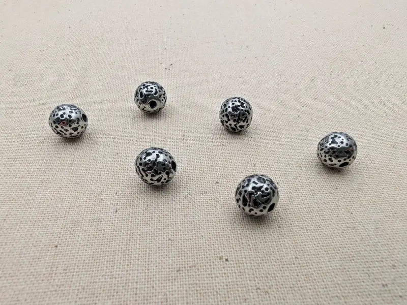 Breloque étoile de mer acier inoxydable 201 – 11,5 mm Les Précieuses Perles