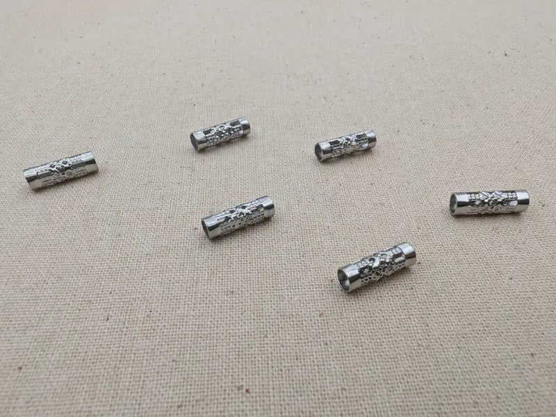 Perles tube ajourées 12x4 mm – Acier inoxydable 201 – Lot de 20 Les Précieuses Perles