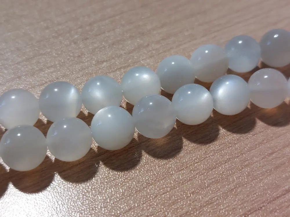 Pierre de lune Grade AA - 10 mm - 1/4 Perles Les Précieuses Perles
