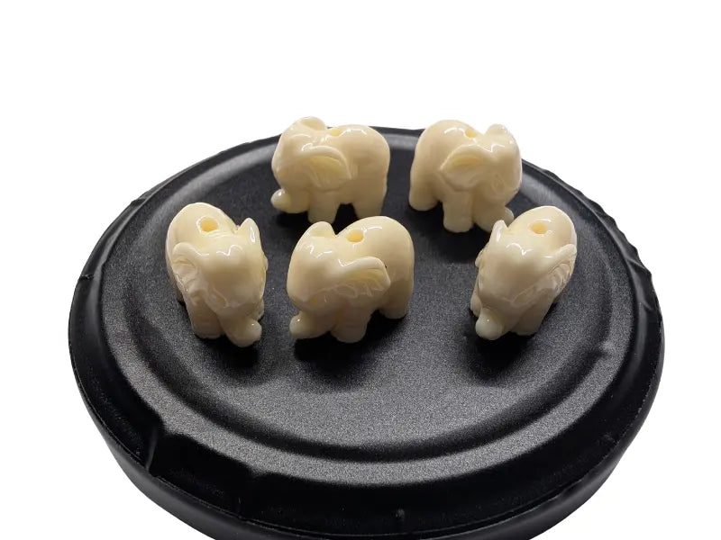 Corail blanc synthétique - Éléphants 10 mm - Lot de 5/10 Les Précieuses Perles