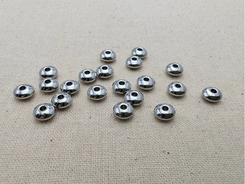 Perles rondelles 6 x 3 mm en acier inoxydable 304 – Lot de 20 Les Précieuses Perles
