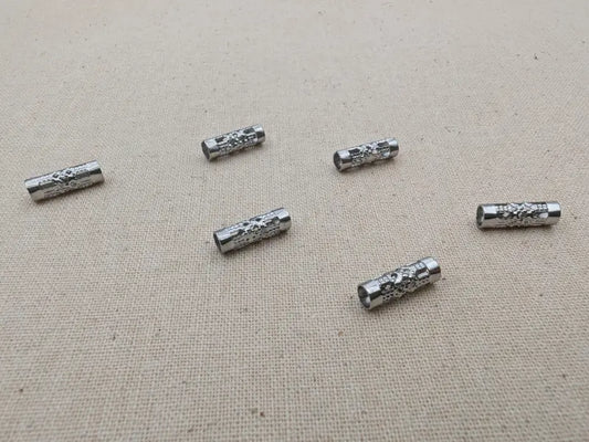 Perles tube ajourées 12x4 mm – Acier inoxydable 201 – Lot de 20 Les Précieuses Perles