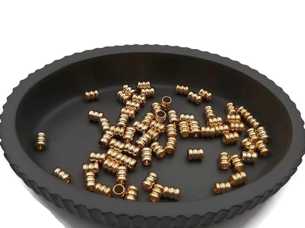 Perles colonnes inox doré 6 x 5 mm Les Précieuses Perles