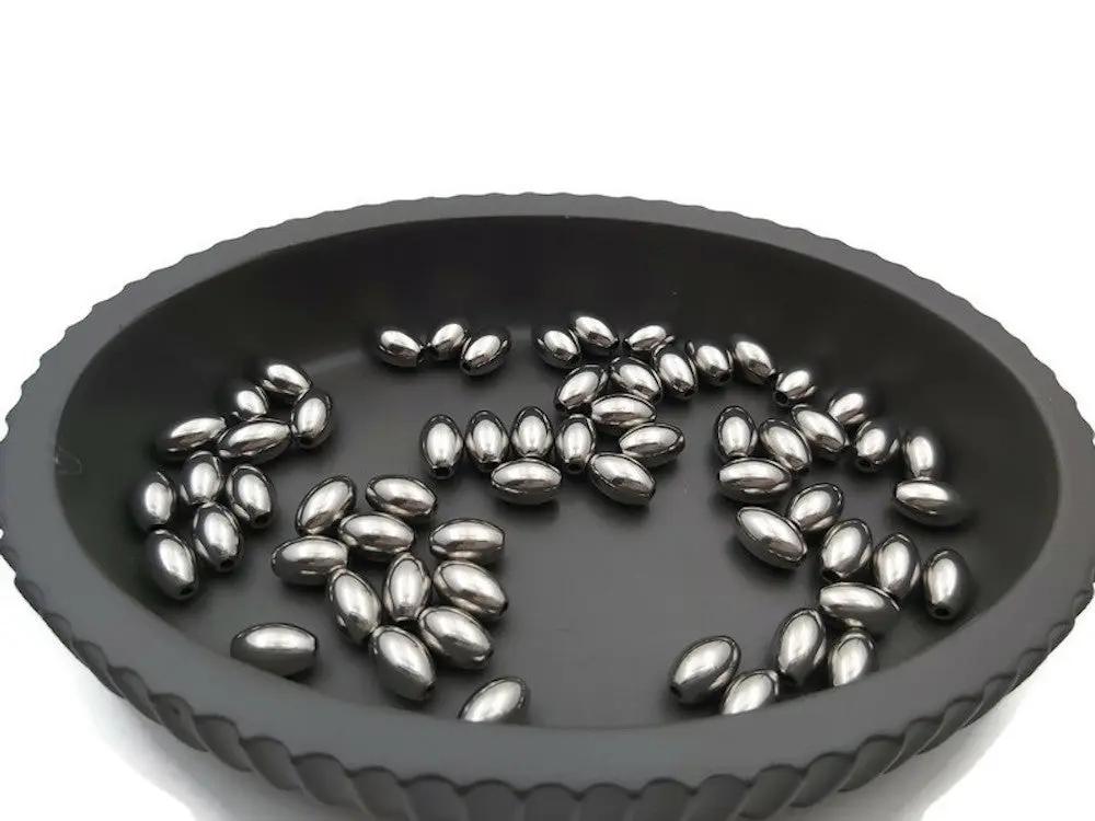 Perles ovales 9 x 6 mm inox - Lot de 10/20 Les Précieuses Perles