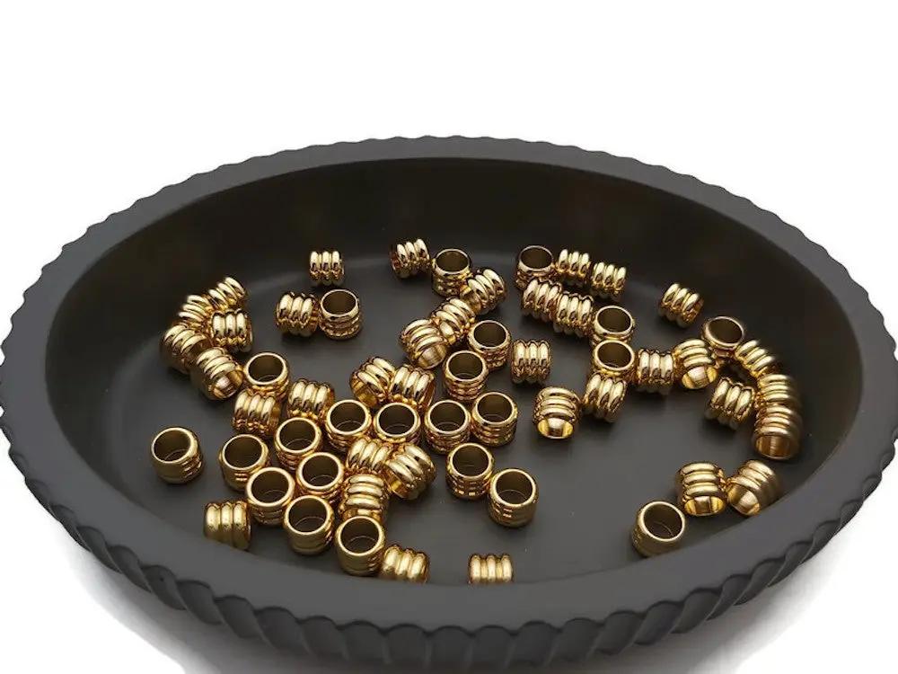 Perles colonnes inox doré 7 x 6 mm - Lot de 10/20 Les Précieuses Perles